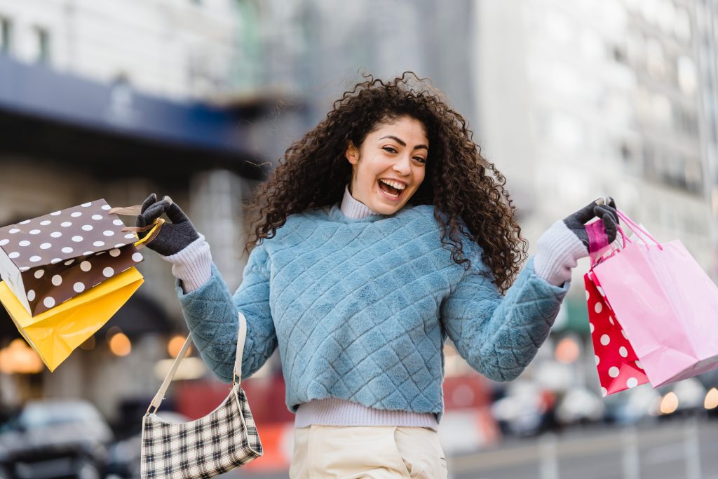 A happy woman smiling with her purchases through short term installment loans