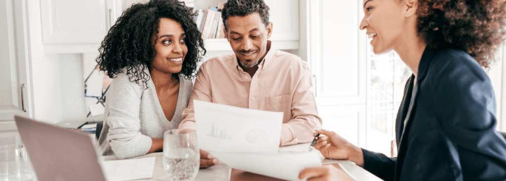 A couple with a woman giving an installent loans online.